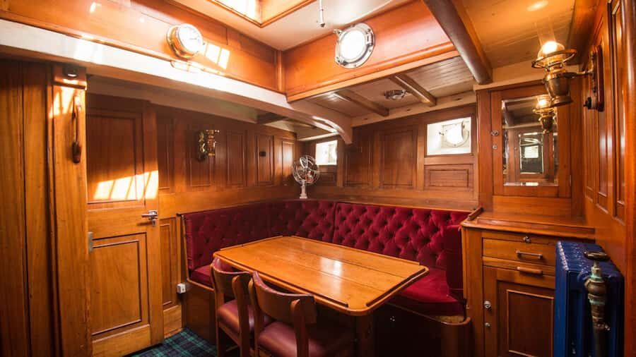 Evening Champagne Cruise on Historic 1935 Motor Yacht. - Faith at the Te Anau wharf: stepping into a 1935 mood