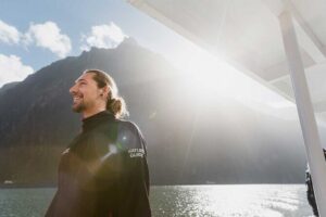 Milford Sound Extended Cruise with Southern Discoveries - Onboard Setup: Indoor Cabins, Covered Decks, and a Guide Who Helps You Look